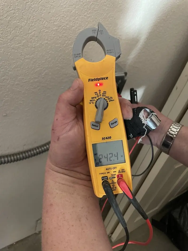 Voltage testing with clamp meter during Circuit Breaker Repair in Elberton